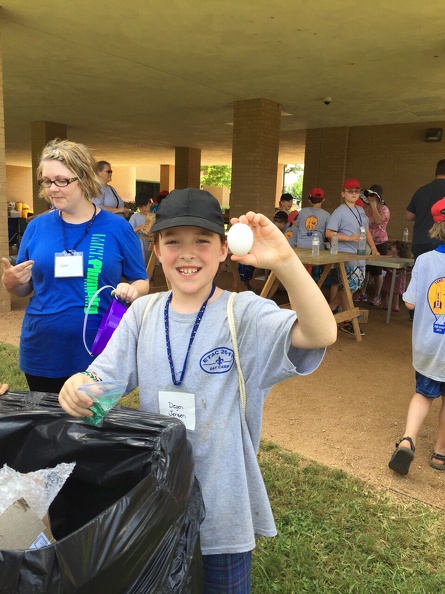 Degen wins the Cub Scout Day Camp Egg Drop again! Last year our secret ingredient was peanut butter—this year it was Easter grass and a geodesic sphere of straws shaped into triangles and taped together. Then the contraption was dropped two stories from a crane, and his egg didn't break! Egg Drop Win